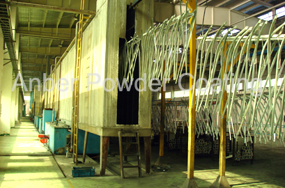 Vertical spray pretreatment system for chair leg powder coating line